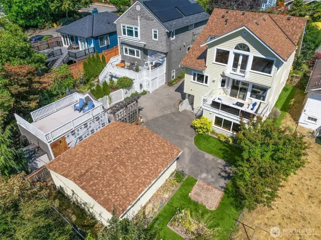 Aerial view of property and detached garage.