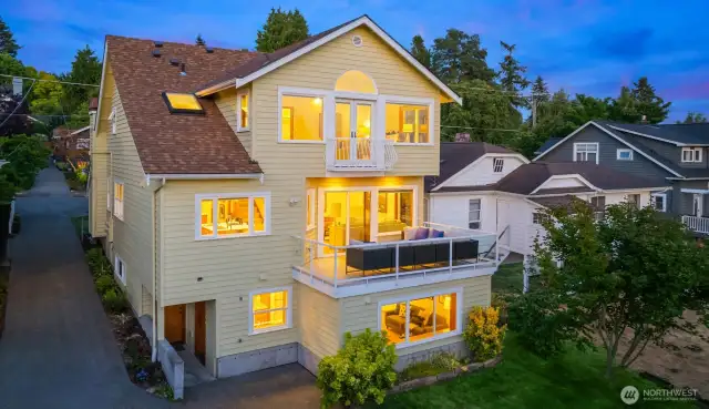 A roomy deck off the main floor sets the stage for laid-back lounging or entertaining, wrapped in glass railings to keep the views front and center.