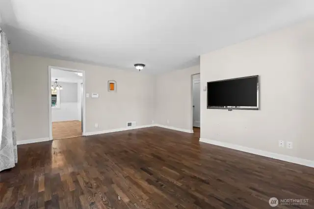 An open layout flows seamlessly into the living and dining areas, making this kitchen the true heart of the home.