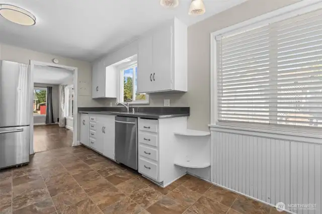 An open layout flows seamlessly into the living and dining areas, making this kitchen the true heart of the home.
