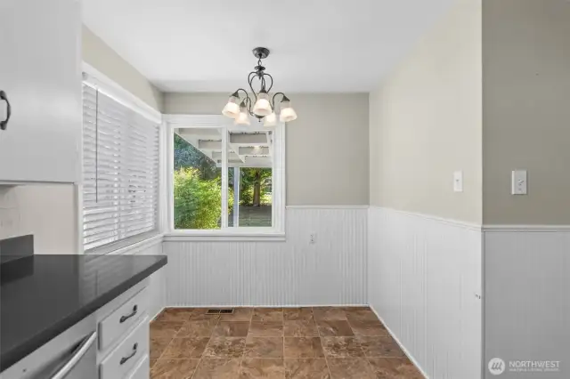 Tucked beside the counter, this eat-in space makes smart use of layout without sacrificing comfort.