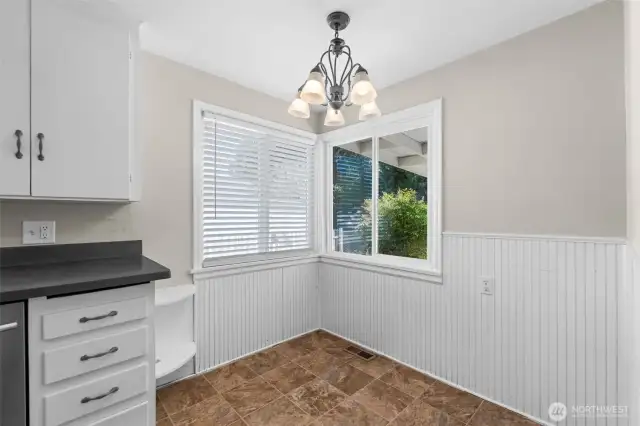 A cozy dining nook sits right inside the kitchen—perfect for quick breakfasts or intimate dinners.