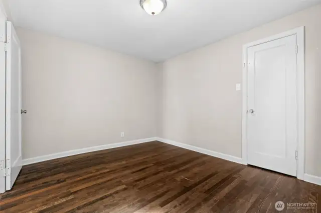 Clean and simple bedroom layout featuring a functional closet