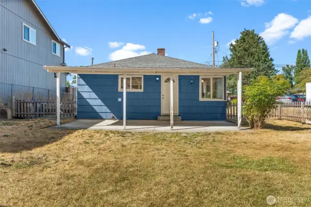 Looking back at the house from the spacious yard—perfect for indoor-outdoor living