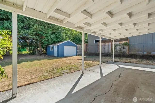 Enjoy peaceful moments on the spacious patio surrounded by greenery.