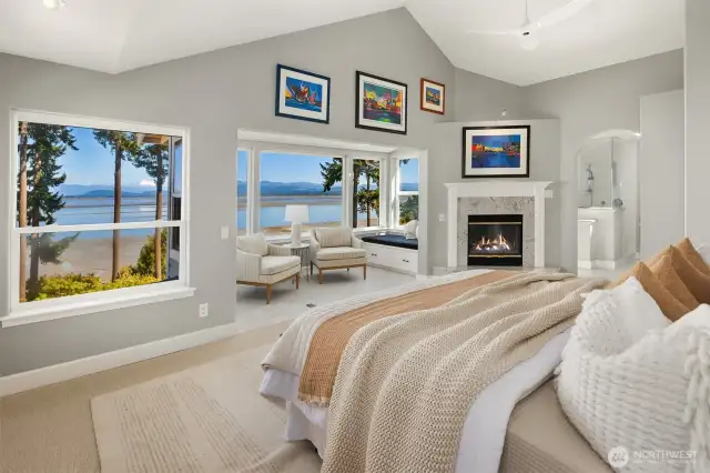 Upper level primary suite with alcove and window seat, perfect for watching the eagles, blue heron's and majestic bay