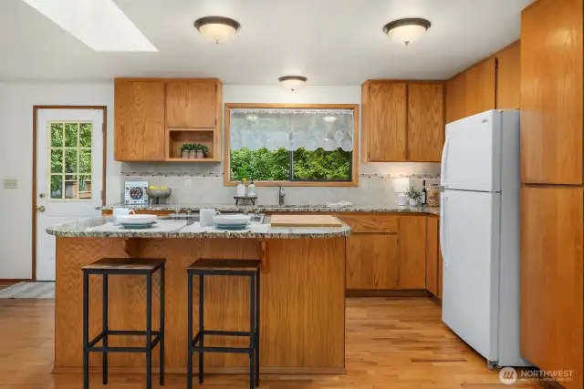 Kitchen with slab granite, undermount sink, eating bar and lots storage!