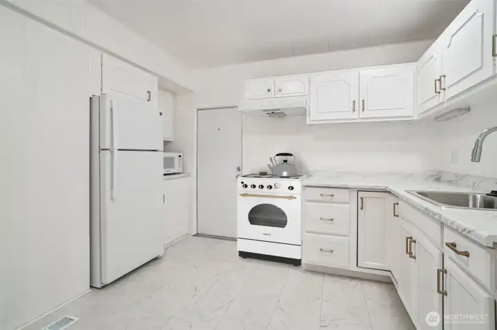 Updated kitchen with new flooring and fresh countertop