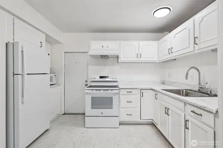 Updated kitchen with new flooring and fresh countertop
