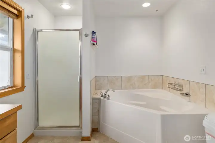 Full bathroom off primary with jetted tub