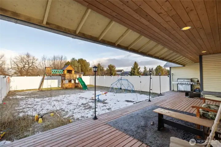 Fully Fenced play yard off of covered deck