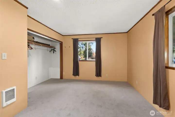 Private primary suite offering a comfortable retreat at the end of the day. New carpet just installed and all the finishing touches are being completed.