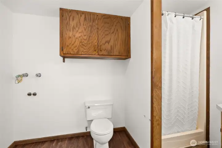 Primary bath with added washer/dryer hookups for flexible convenience.
