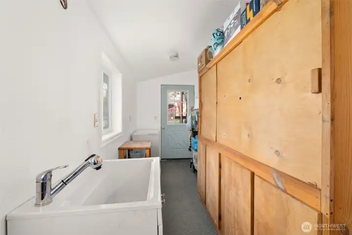 Mudroom entry leads into the laundry area, perfect for boots, coats, and busy outdoor days.