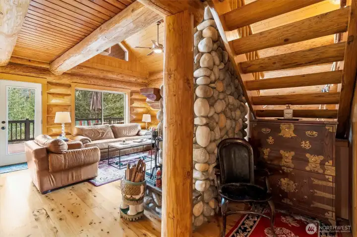 Hallway leading to great room and under-stairway nook.