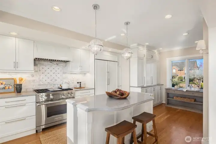 Designer kitchen with quartz counters, custom cabinets and upscale appliances