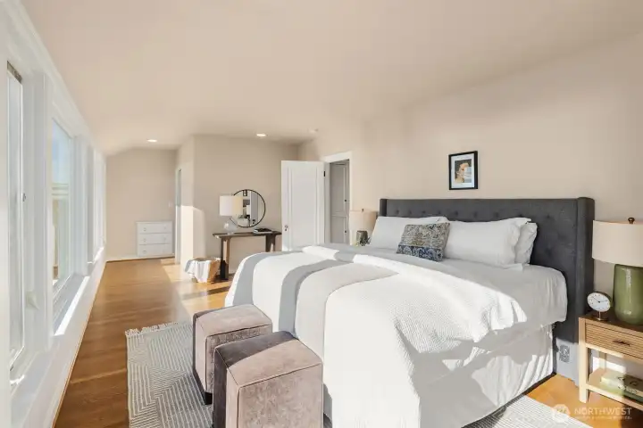 The ensuite bathroom is next to the built in drawers. Notice the linen closet in the hallway.