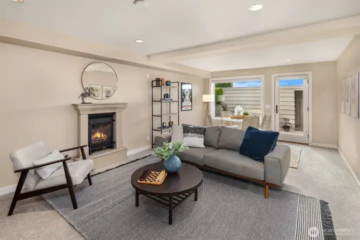 Daylight lower level with gas fireplace and new carpet.