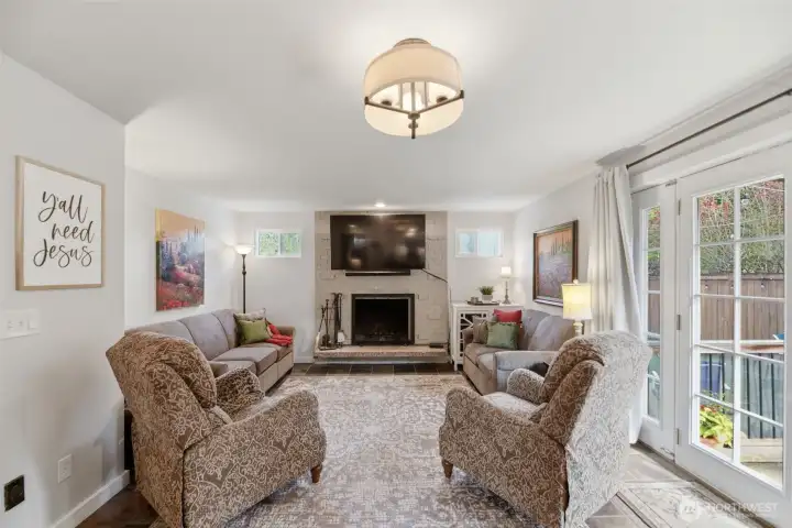 Family room with wood fireplace.  TV stays!