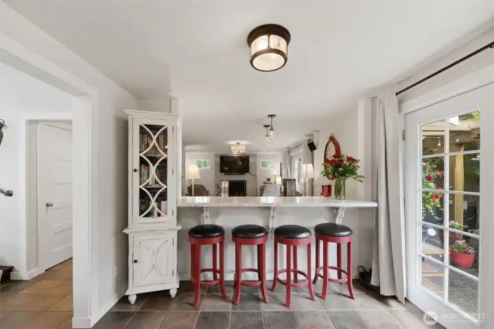 Extra eating bar & French doors to the patio.
