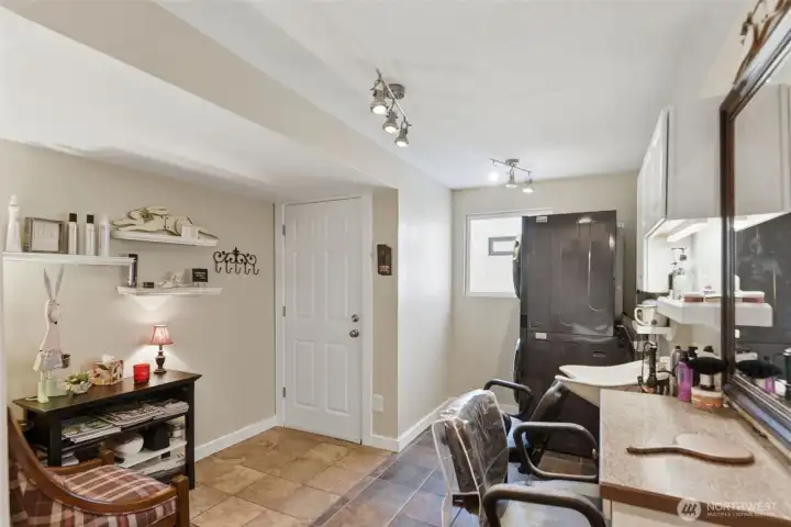 Flexible space currently used as a hair salon; offering endless possibilities for a home business or office with separate side door entrance.
