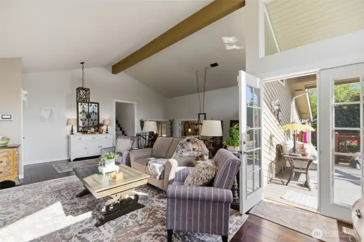 French doors from living room to outdoor deck.