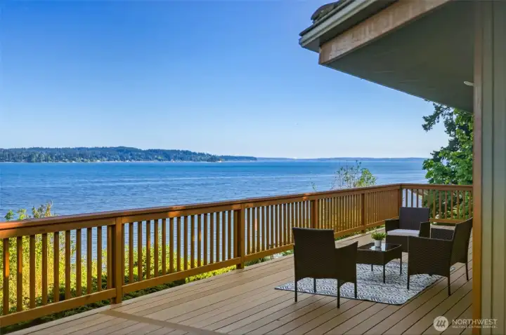 Outdoor entertaining space featuring expansive water views and a serene natural setting.