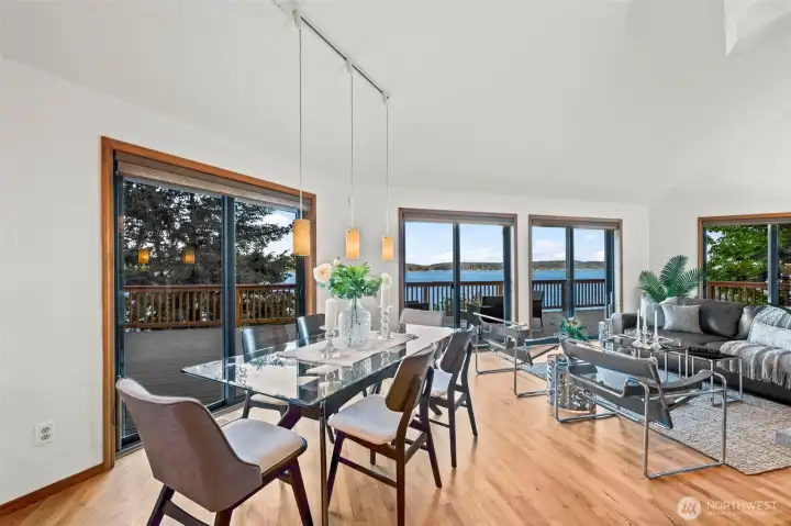 Main gathering spaces feature large windows and access to the waterfront deck.