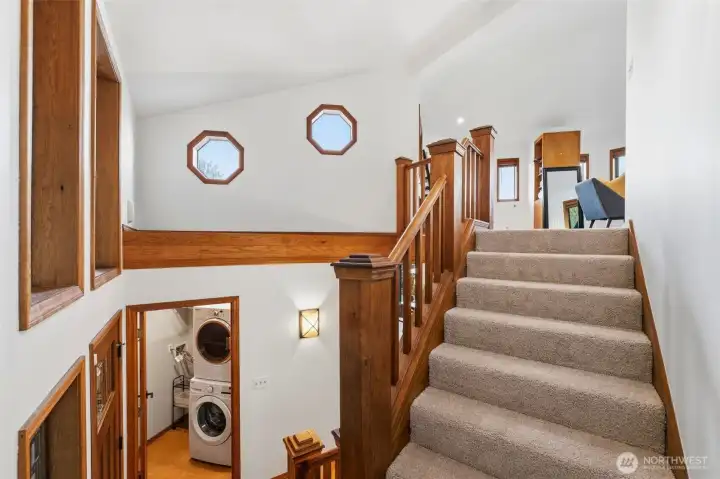 Welcoming stairway design featuring warm finishes and timeless Northwest style.