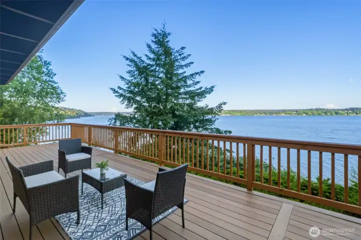 Waterfront outdoor living area offering seamless space for dining or lounging.