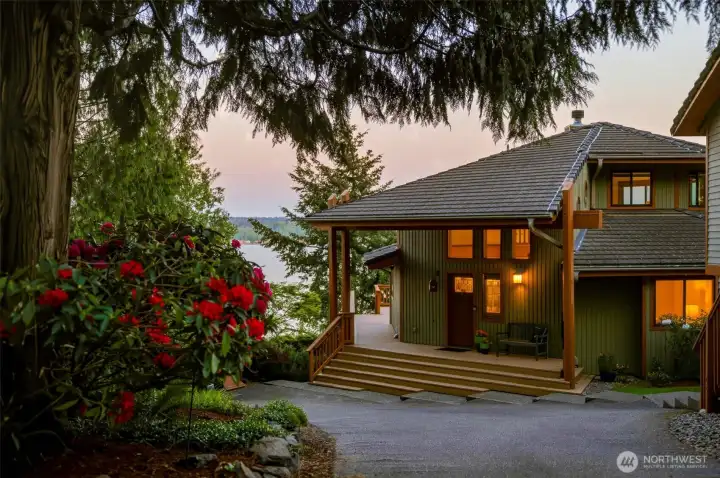 Exterior view highlighting the home’s natural setting and architectural details.