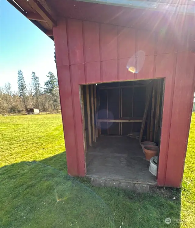 Small out-building in the pasture, there is also a wood storage shed and pump house located on the front/side of the property.