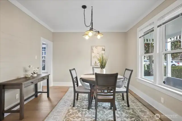 Terrific view of formal dining room. Crown molding, new laminate flooring!