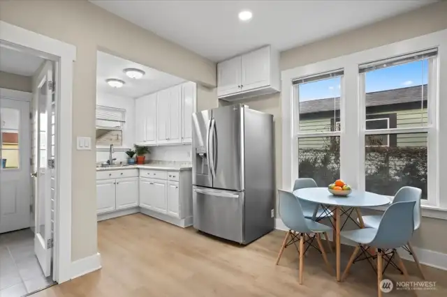 Very large kitchen. New LG refrigerator, stove and microwave. Photographer asked us to raise all blinds so not visible. All blinds have been ordered through Blinds.com.