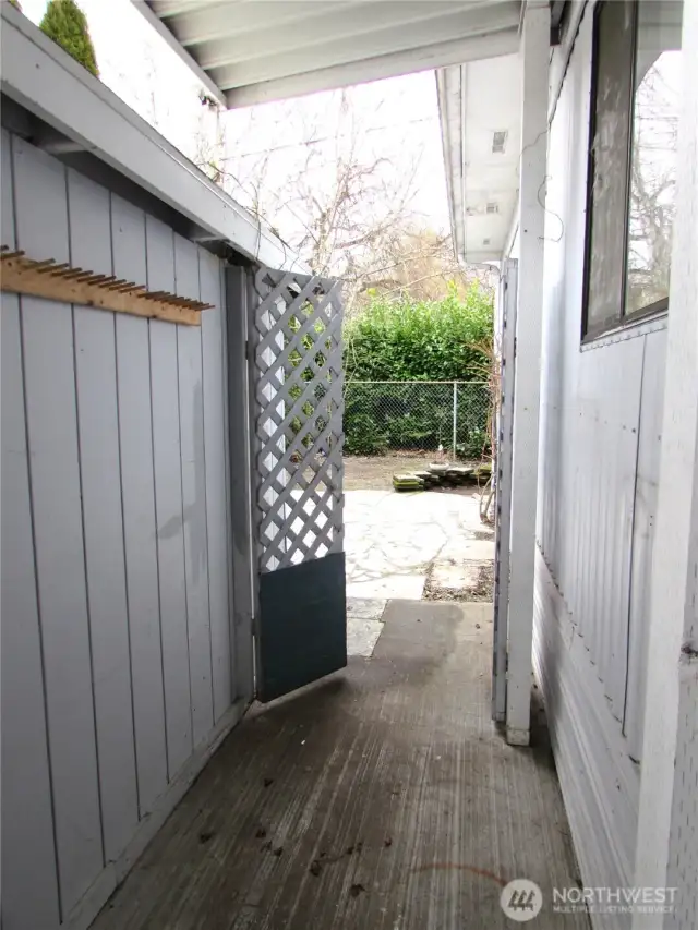 GATE TO FENCED BACK YARD W/ PATIO