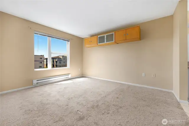 Primary bedroom with tons of natural light and views of City and beyond! un-staged