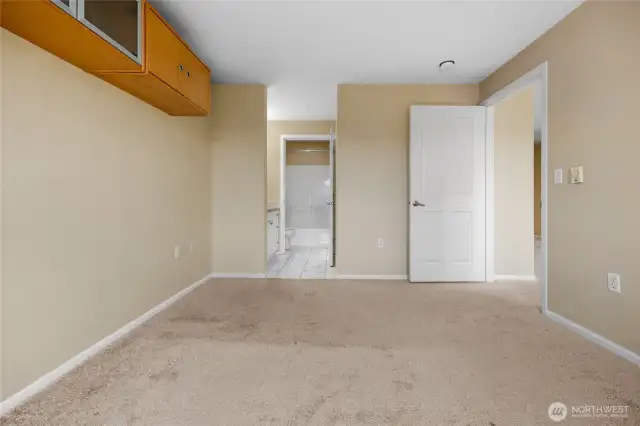 Primary bedroom with entrance to walk-in closet and en-suite full bathroom!