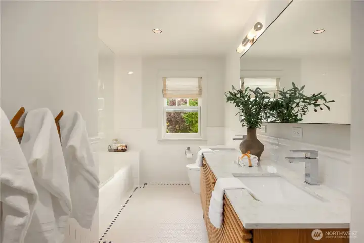 Between the second and third bedroom is this beautiful bathroom.