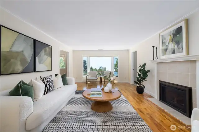 Cozy living area with propane fireplace and views out to Burrow's Bay.