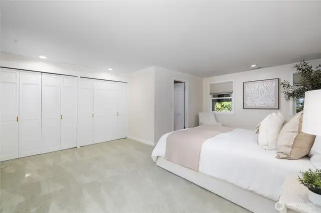 Large primary suite with windows out to view and also back out to the beautiful garden.