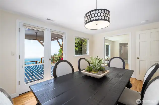 Glass French doors out to huge deck from the dining area.