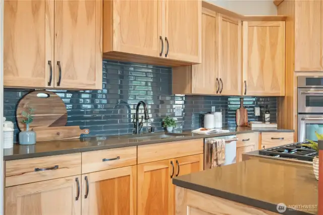 Slab counters and full tile backsplash.