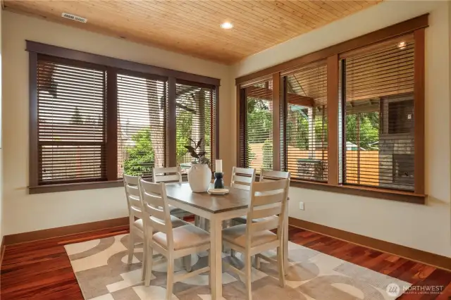 Formal dining overlooks outdoor living space.