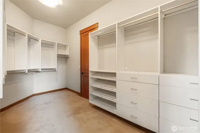 Primary closet with custom organization.