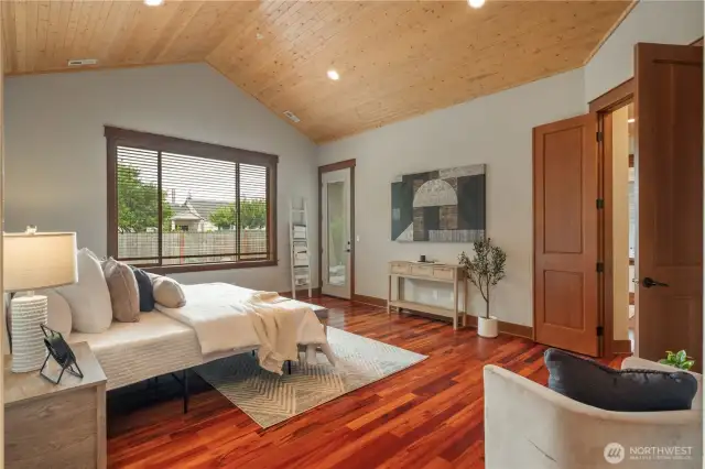 Primary suite offers private door to covered outdoor space.
