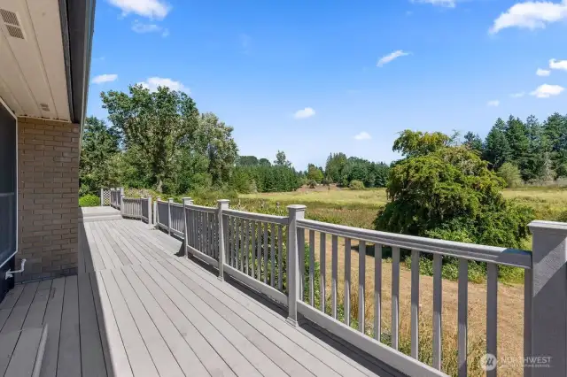 Expansive Front Deck faces Pond and Green Space