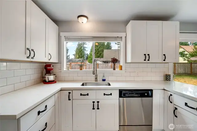 Enjoy the view looking into the fully fenced yard from the kitchen