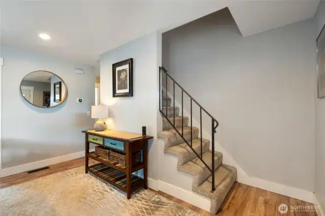 Entryway leading to staircase to upper level
