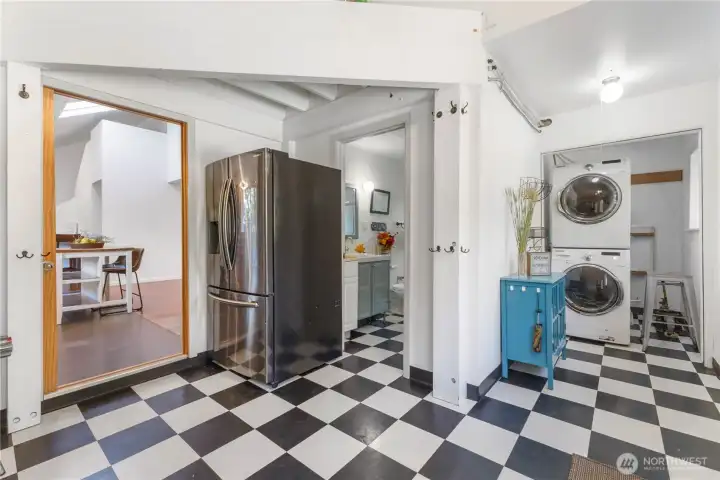 Enter to a HUGE mudroom with laundry and bath