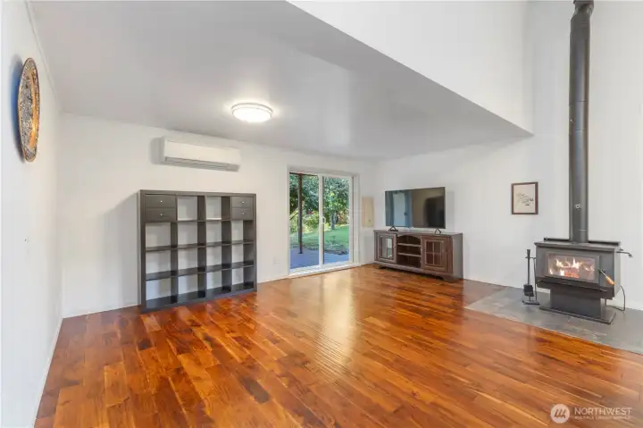 Large sliding doors lead to partially covered large deck